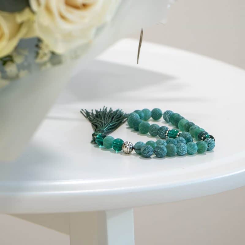 white green beeds close close up of prayer beads