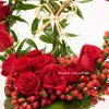 red roses with hypericum