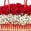 close up of red roses and gypsophelia