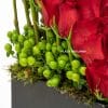 close up of red roses and hypericum