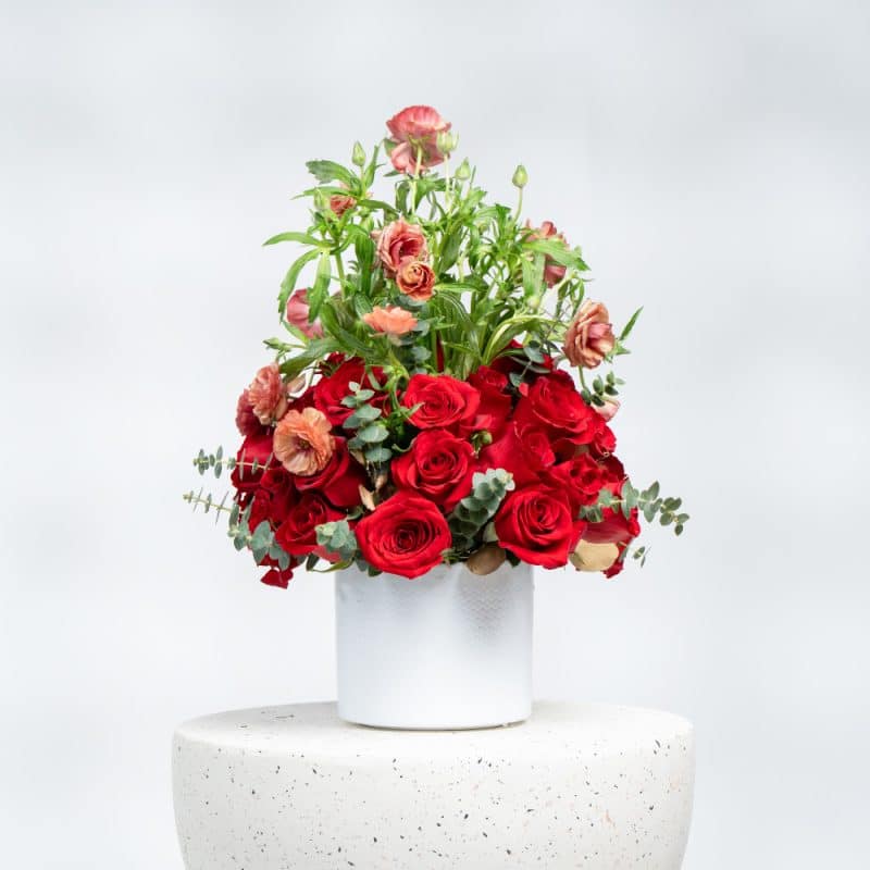 White Pot Floral Display with Red Roses, Baby Roses & Eucalyptus