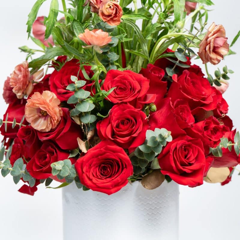 White Pot Floral Display with Red Roses, Baby Roses & Eucalyptus