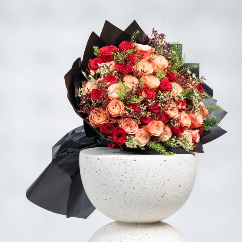 Elegant Blend: Orange & Red Roses with White and Purple Limonium
