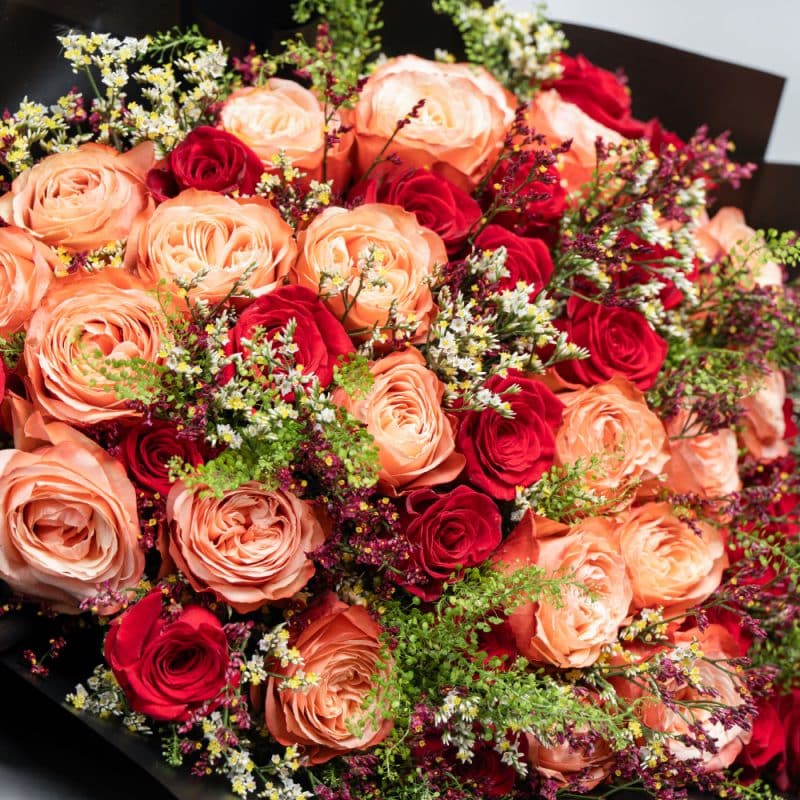 Elegant Blend: Orange & Red Roses with White and Purple Limonium