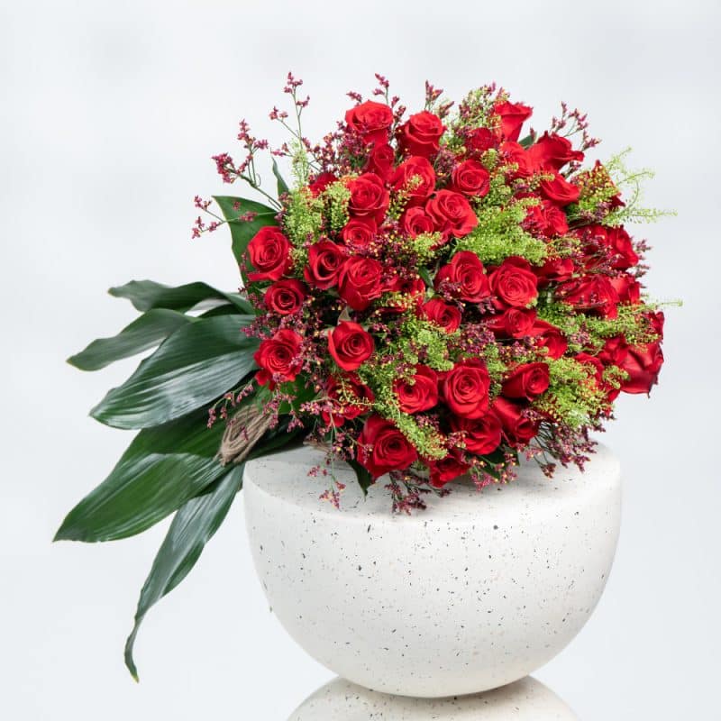Charming Floral Mix: Red Roses, Limonium, Green Bell & Aspidistra