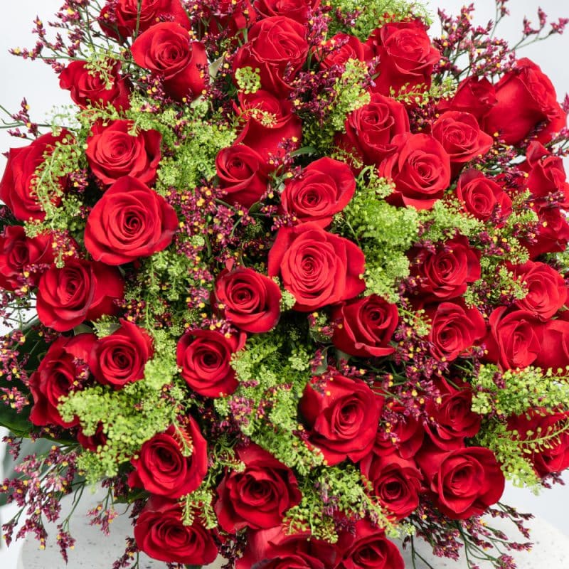 Charming Floral Mix: Red Roses, Limonium, Green Bell & Aspidistra