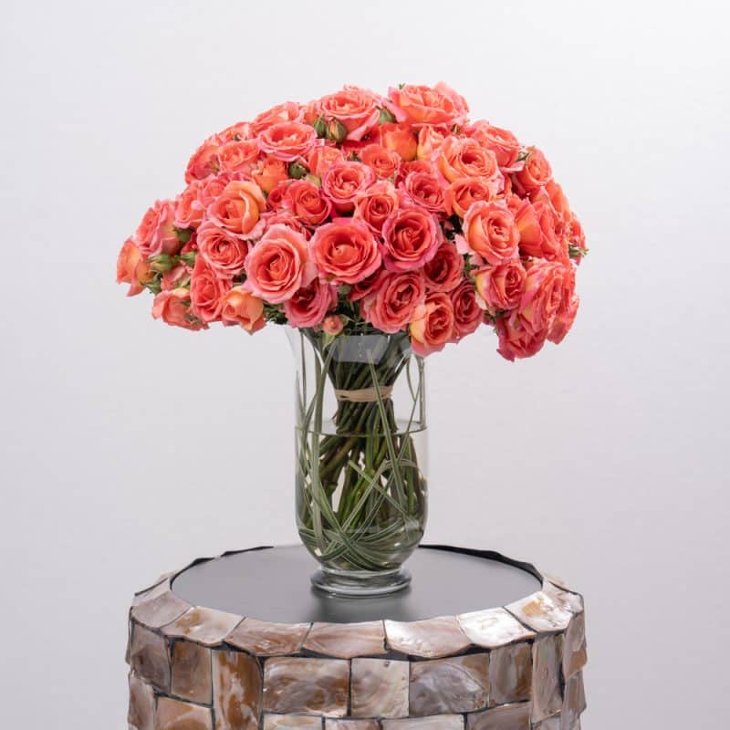 Dark Orange Spray rose in Glass Vase