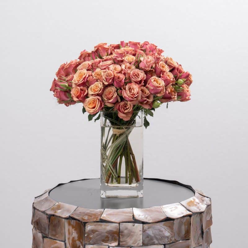 Delicate Pink Spray Roses Display in Glass Vase