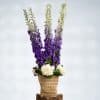 Blue Delphinium & White Roses in Reed Basket – 100cm