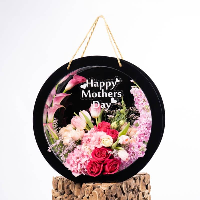 "Stunning arrangement of Tulips, Calla Lilies, Hydrangea, Mattiola, Limonium, Eustoma, and Fuchsia Roses, offering a vibrant and elegant floral display."